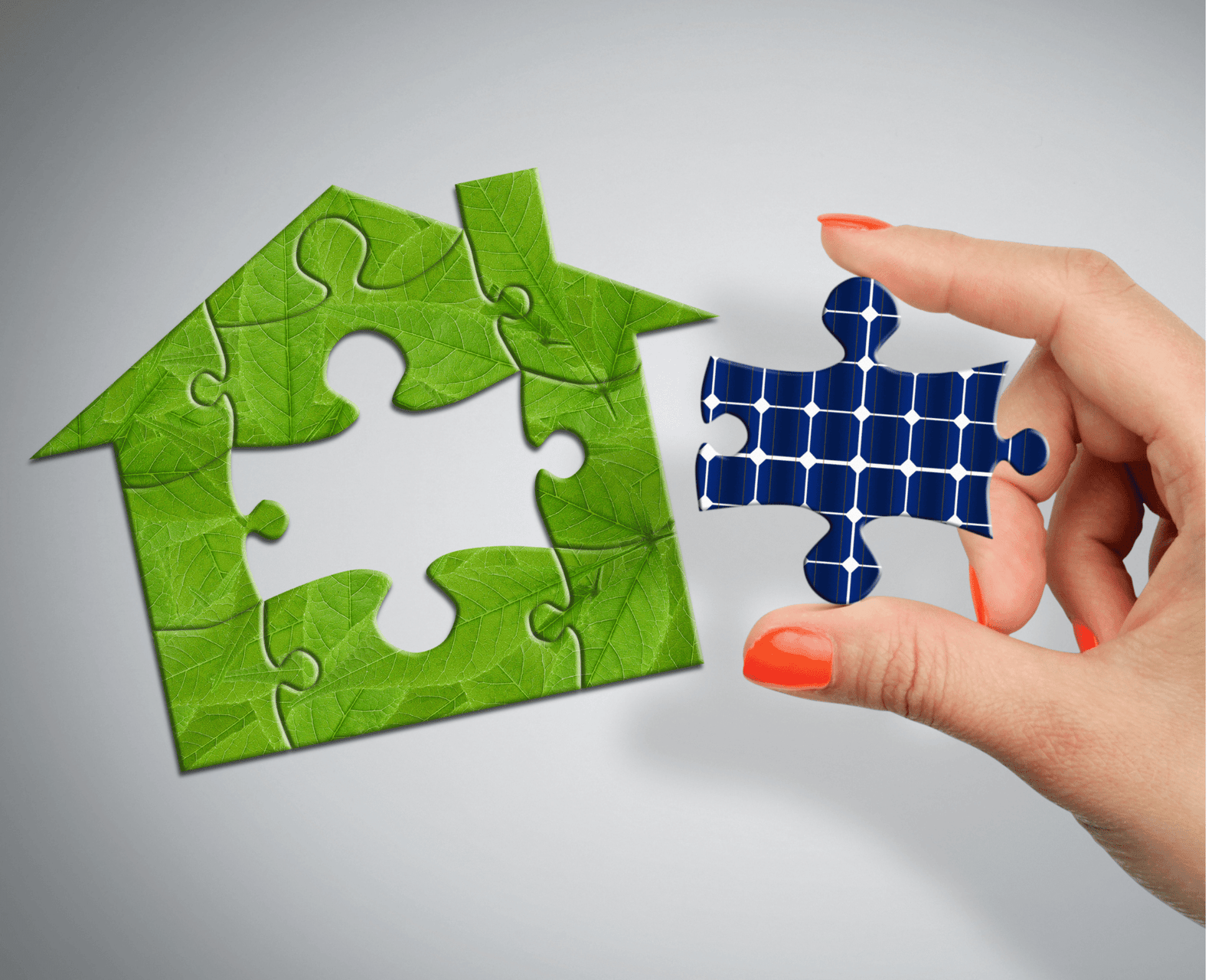 a hand holding a puzzle piece and a house made of leaves Frostec Solar Powers